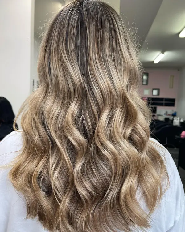Honey blonde balayage with a rooted finish