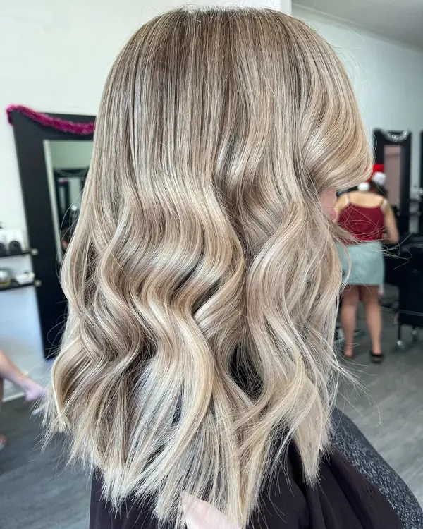 Bright blonde balayage on a mid-length cut